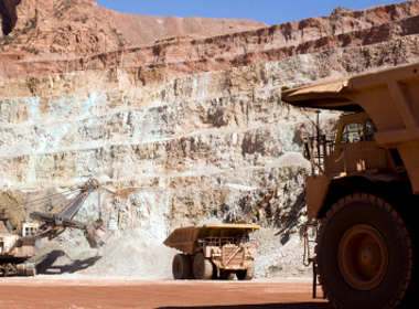 Haul trucks in a coppermine